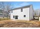 Exterior view of the backyard with a newly installed fence, patio, and a view of the home at 13110 Blacksmith Ct, Matthews, NC 28105