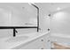 Bright bathroom featuring double sinks, white cabinets, and modern fixtures at 13110 Blacksmith Ct, Matthews, NC 28105