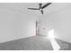 Neutral bedroom featuring a ceiling fan and doorway leading to another room at 13110 Blacksmith Ct, Matthews, NC 28105