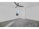 Bedroom featuring a modern ceiling fan, double door closet, and a window at 13110 Blacksmith Ct, Matthews, NC 28105