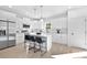 Modern kitchen with stainless steel appliances, white cabinets, and a center island with seating at 13110 Blacksmith Ct, Matthews, NC 28105