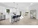 Modern kitchen with stainless steel appliances, white cabinets, and a center island with seating at 13110 Blacksmith Ct, Matthews, NC 28105