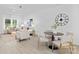 Bright living room open to kitchen and dining area with a neutral palette and modern furnishings at 13110 Blacksmith Ct, Matthews, NC 28105