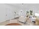 Bright and airy living room with modern decor, light wood floors, and large windows at 13110 Blacksmith Ct, Matthews, NC 28105