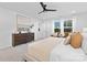 Bright and spacious main bedroom with a ceiling fan, a neutral color scheme, and large windows at 13110 Blacksmith Ct, Matthews, NC 28105