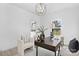 Bright home office featuring stylish lighting, a modern desk, and comfortable seating near a bathroom at 13110 Blacksmith Ct, Matthews, NC 28105