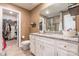 Bathroom features a granite vanity with storage and a walk-in closet to the left at 147 Colonial Reserve Ave, Troutman, NC 28166