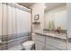 Well-maintained bathroom with a shower, vanity, granite countertop, and a framed mirror at 147 Colonial Reserve Ave, Troutman, NC 28166