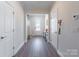 Inviting foyer with hardwood flooring and easy access to coat closet and entry to main living area at 147 Colonial Reserve Ave, Troutman, NC 28166