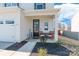 Inviting front porch with seating, decorative welcome sign, and attractive landscaping at 147 Colonial Reserve Ave, Troutman, NC 28166