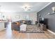 Cozy living room with stylish decor, a plush sectional, and a decorative accent wall at 147 Colonial Reserve Ave, Troutman, NC 28166