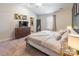 Main bedroom with vaulted ceiling, ceiling fan, ensuite bathroom, and dresser with TV at 147 Colonial Reserve Ave, Troutman, NC 28166