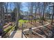 Landscaped backyard with a stone pathway leading to a private waterfront with a lake view at 15015 Nc Hwy 73 Hwy, Huntersville, NC 28078