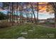 Lush backyard with a stone path leading to the lake, perfect for outdoor enjoyment at 15015 Nc Hwy 73 Hwy, Huntersville, NC 28078