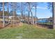 Manicured backyard with stone path to the lake at 15015 Nc Hwy 73 Hwy, Huntersville, NC 28078