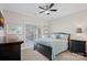 Comfortable bedroom with a ceiling fan and a window that lets in natural light at 15015 Nc Hwy 73 Hwy, Huntersville, NC 28078