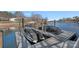Waterfront property featuring a private boat dock with two covered boats, offering serene lake views at 15015 Nc Hwy 73 Hwy, Huntersville, NC 28078