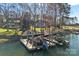 Lakeside estate showcasing a private boat dock with boat lifts amidst the beautiful waterfront property at 15015 Nc Hwy 73 Hwy, Huntersville, NC 28078