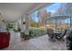 Spacious covered patio with a table, chairs, and lush backyard view at 15015 Nc Hwy 73 Hwy, Huntersville, NC 28078