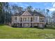 Stunning home exterior with multiple balconies and well-maintained lawn at 15015 Nc Hwy 73 Hwy, Huntersville, NC 28078