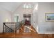 Elegant foyer with hardwood floors, high ceilings, and a decorative chandelier at 15015 Nc Hwy 73 Hwy, Huntersville, NC 28078