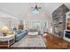 Spacious living room featuring a stone fireplace, hardwood floors, and access to outdoor views at 15015 Nc Hwy 73 Hwy, Huntersville, NC 28078