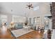 Open-concept living room with hardwood floors, high ceilings, and seamless flow to adjacent spaces at 15015 Nc Hwy 73 Hwy, Huntersville, NC 28078