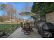 Outdoor dining area with patio furniture and a barbecue grill, perfect for entertaining at 15015 Nc Hwy 73 Hwy, Huntersville, NC 28078