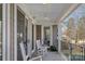 Charming covered porch with rocking chairs, ceiling fans, and views at 15015 Nc Hwy 73 Hwy, Huntersville, NC 28078