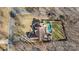 An aerial view showcases a house with a pool and well-maintained yard and an adjacent road at 153 Byers Rd, Troutman, NC 28166