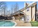 Large deck, in-ground pool, and backyard with plenty of space for outdoor entertaining at 153 Byers Rd, Troutman, NC 28166
