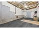 Unfinished basement with exposed ceiling, concrete walls, and a rubber floor ready to be customized at 153 Byers Rd, Troutman, NC 28166