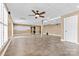 Spacious finished basement featuring neutral walls, tiled floors, and a decorative ceiling with a ceiling fan at 153 Byers Rd, Troutman, NC 28166