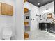 Contemporary bathroom featuring a sleek black vanity, vessel sink, modern lighting, and marble tile flooring at 153 Byers Rd, Troutman, NC 28166