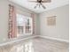 Cozy bedroom with window, curtains, and tile flooring, creating a comfortable retreat at 153 Byers Rd, Troutman, NC 28166
