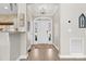 The foyer has wood floors and neutral walls at 153 Byers Rd, Troutman, NC 28166