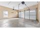 Spacious two-car garage with white doors, neutral walls, and a smooth concrete floor at 153 Byers Rd, Troutman, NC 28166