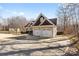 This is the garage of a home that has a gable roof and three garage doors at 153 Byers Rd, Troutman, NC 28166