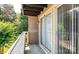Cozy balcony with wood floors, siding and a sliding glass doors for a seamless indoor/outdoor living experience at 1614 Arlyn Cir, Charlotte, NC 28213