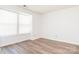 Bright bedroom with large windows and new floors at 1614 Arlyn Cir, Charlotte, NC 28213