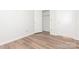 Bedroom with closet and new wood-look flooring at 1614 Arlyn Cir, Charlotte, NC 28213