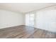 Bright living room with sliding glass door, new floors and lots of natural light at 1614 Arlyn Cir, Charlotte, NC 28213