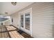 Spacious covered balcony with ceiling lights and an exterior view through glass doors at 19531 Deer Valley Dr, Cornelius, NC 28031