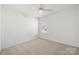 Cozy bedroom with a ceiling fan, neutral carpet and natural light at 19531 Deer Valley Dr, Cornelius, NC 28031