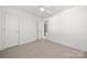 Bright bedroom offers neutral carpet, closet and ample natural light at 19531 Deer Valley Dr, Cornelius, NC 28031