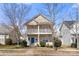 Charming two-story home with a welcoming front porch and neat landscaping at 19531 Deer Valley Dr, Cornelius, NC 28031
