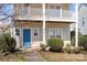 Close-up of a home's entryway with a blue front door and manicured bushes at 19531 Deer Valley Dr, Cornelius, NC 28031