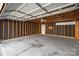 Spacious unfinished garage interior with concrete floor, a door and a ceiling fan at 19531 Deer Valley Dr, Cornelius, NC 28031