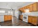 Open kitchen with stainless steel refrigerator and view to living room at 19531 Deer Valley Dr, Cornelius, NC 28031