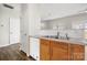 Modern kitchen with stainless steel sink, wood cabinets and open floor plan at 19531 Deer Valley Dr, Cornelius, NC 28031